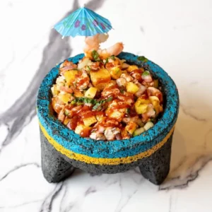 Authentic Sinaloa-style Ceviche Tropical Mixto served in a traditional stone molcajete at Unos Mariscos O Que in Round Rock, TX.